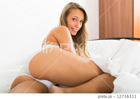 Girl in underwear on bed - Stock Photo [12716311] - PIXTA