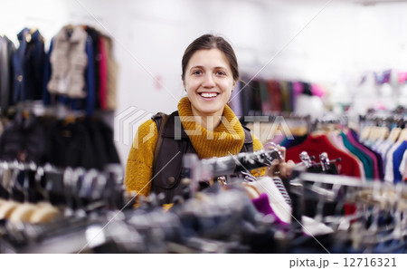 Smiling girl at clothing store 12716321