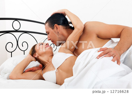 couple in bed in bedroom couple in bed in bedroom 12716628
