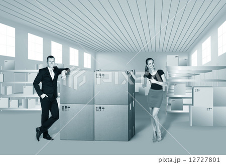 Young woman and man in warehouse Young woman and man in warehouse 12727801