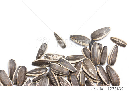 Sunflower seeds on white background. 12728304