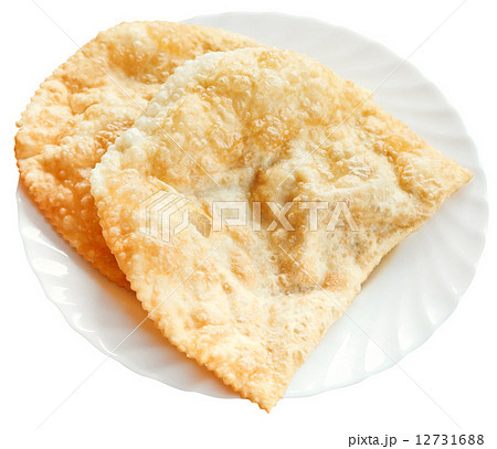 cheburek pie on white plate isolated 12731688