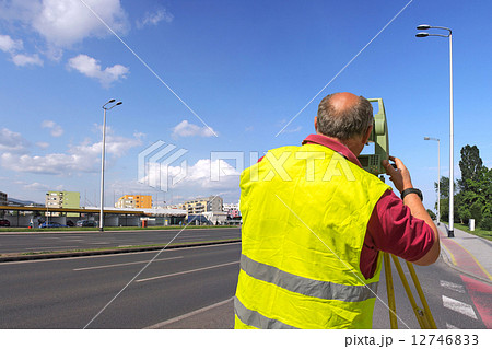 Surveyor measuring 12746833