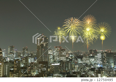 Fireworks celebrating over Tokyo cityscape at night Fireworks celebrating over Tokyo cityscape at night 12750495