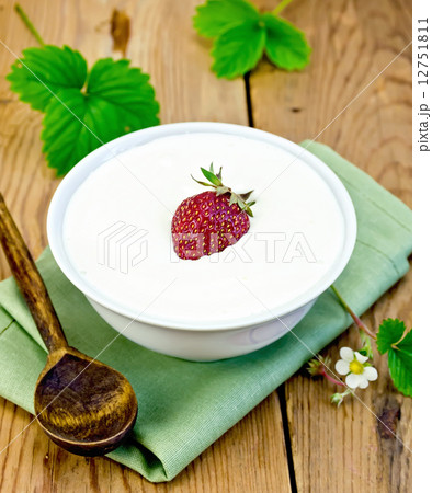 Yogurt thick with strawberries in bowl on board 12751811