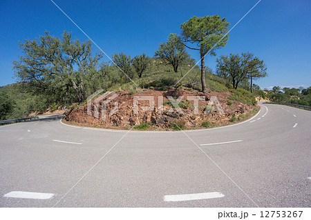 Worms eye view of mountain hairpin bend curved road 12753267