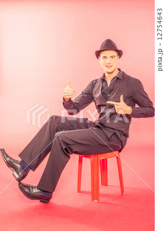 Handsome young man wearing a fashionable hat Handsome young man wearing a fashionable hat 12754643