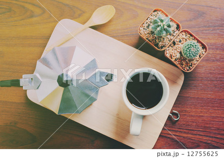 Hot coffee and moka pot with cactus, retro filter effect 12755625