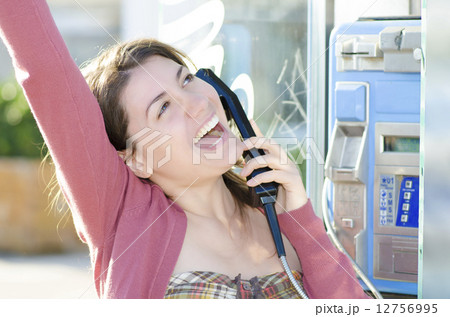 A happy woman talking at phone A happy woman talking at phone 12756995