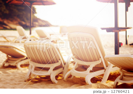 Row of beach chairs on the sea Row of beach chairs on the sea 12760421