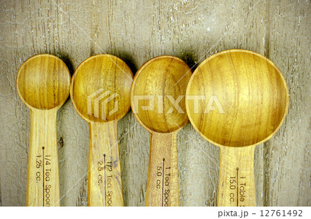 Wood Measuring Spoon on Grungy Wood Background. Wood Measuring Spoon on Grungy Wood Background. 12761492