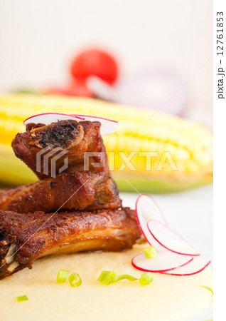 pork ribbs on polenta corn cream bed 12761853