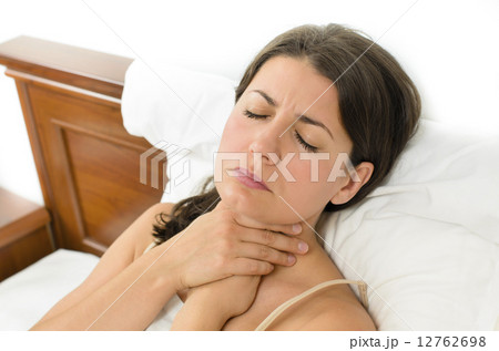 Woman having sore throat 12762698
