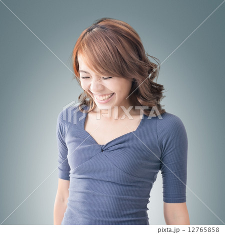 Shy Asian girl smiling 12765858