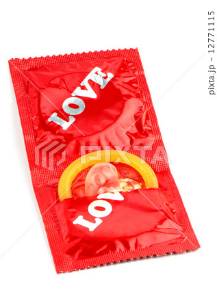 Latex Condom on White Background. 12771115