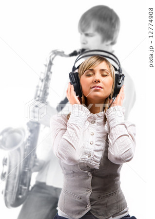 Lovely girl in headphones listening music 12774908