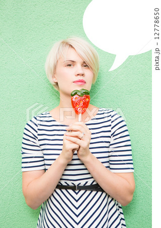 Young sexy woman sucking lollipop.  12778650