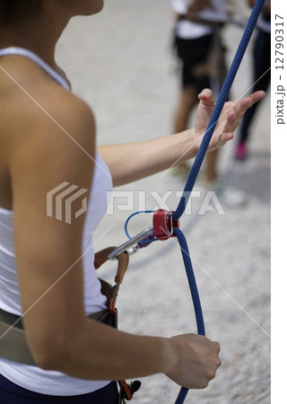 Close up of Woman's hand in belaying activities Close up of Woman's hand in belaying activities 12790317