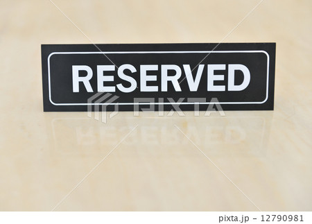 Reserved sign on the table 12790981