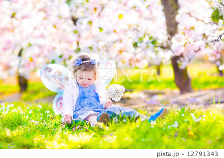 Little girl in blooming garden Little girl in blooming garden 12791343