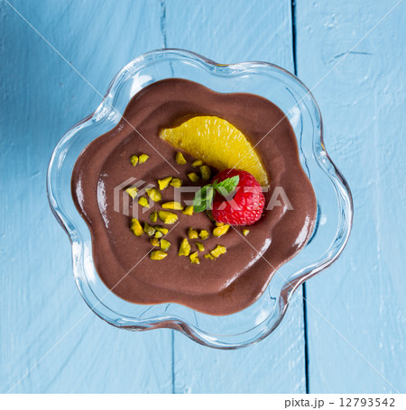 Chocolate pudding dessert with orange and pistachio 12793542