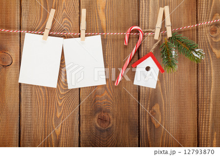 Snow fir tree, photo frame and christmas decor on rope 12793870