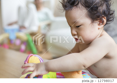 Baby boy playing indoors. Baby boy playing indoors. 12798017