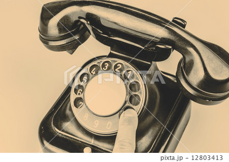 Old black phone with dust and scratches on white background Old black phone with dust and scratches on white background 12803413
