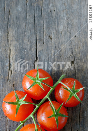 ripe cherry tomatoes on wood ripe cherry tomatoes on wood 12805167