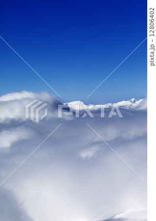 Mountains under clouds and clear sunny sky 12806402