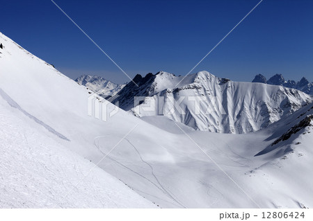 View on snowy off piste slope with trace from avalanche 12806424