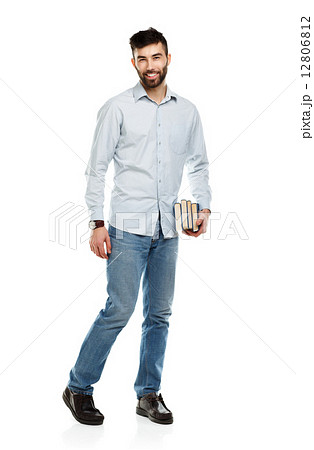Young bearded smiling man with books in hand on white Young bearded smiling man with books in hand on white 12806812
