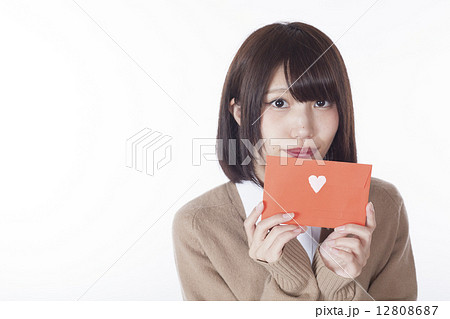 手紙を渡す女子高生の写真素材