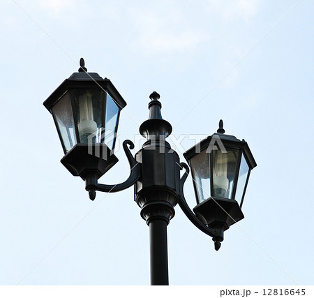 Old city lamp isolated on sky Old city lamp isolated on sky 12816645