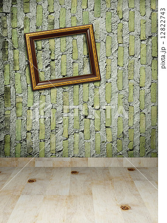 Gold frame on a old wall room background 12822743