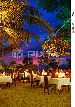 Outdoor restaurant at the beach during sunset, Phuket, Thailand Outdoor restaurant at the beach during sunset, Phuket, Thailand 12827302