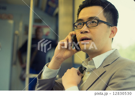 business man using phone at subway 12830530