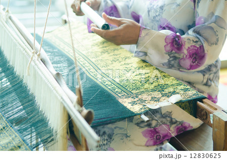 traditional batik cloth making by a woman in malaysia 12830625