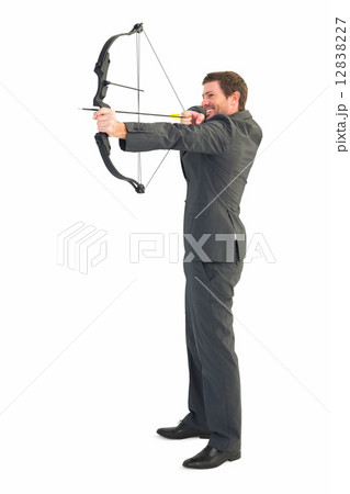 Businessman shooting a bow and arrow 12838227