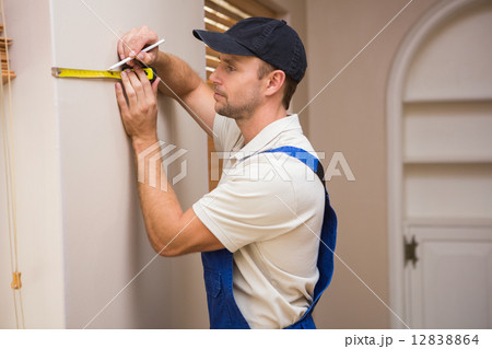 Construction worker using spirit level Construction worker using spirit level 12838864