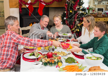 Three generation family having christmas dinner together 12839439
