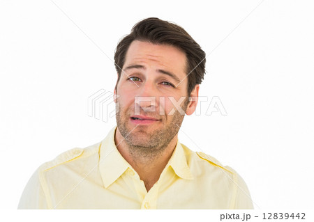 Handsome young man looking confused 12839442