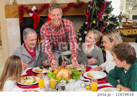 Man serving roast turkey at christmas 12839638
