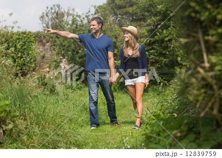 Cute couple walking holding hands Cute couple walking holding hands 12839759