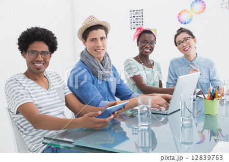 Young creative team having a meeting Young creative team having a meeting 12839763