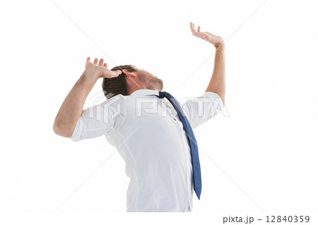 Businessman in suit with hands raised 12840359