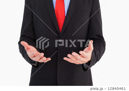 Businessman presenting with his hands Businessman presenting with his hands 12840461