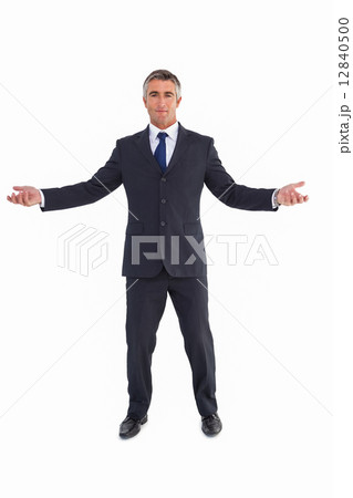 Cheerful businessman spreading his arms Cheerful businessman spreading his arms 12840500