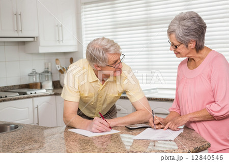 Senior couple paying their bills 12840546