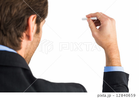 Businessman writing with a white chalk 12840659